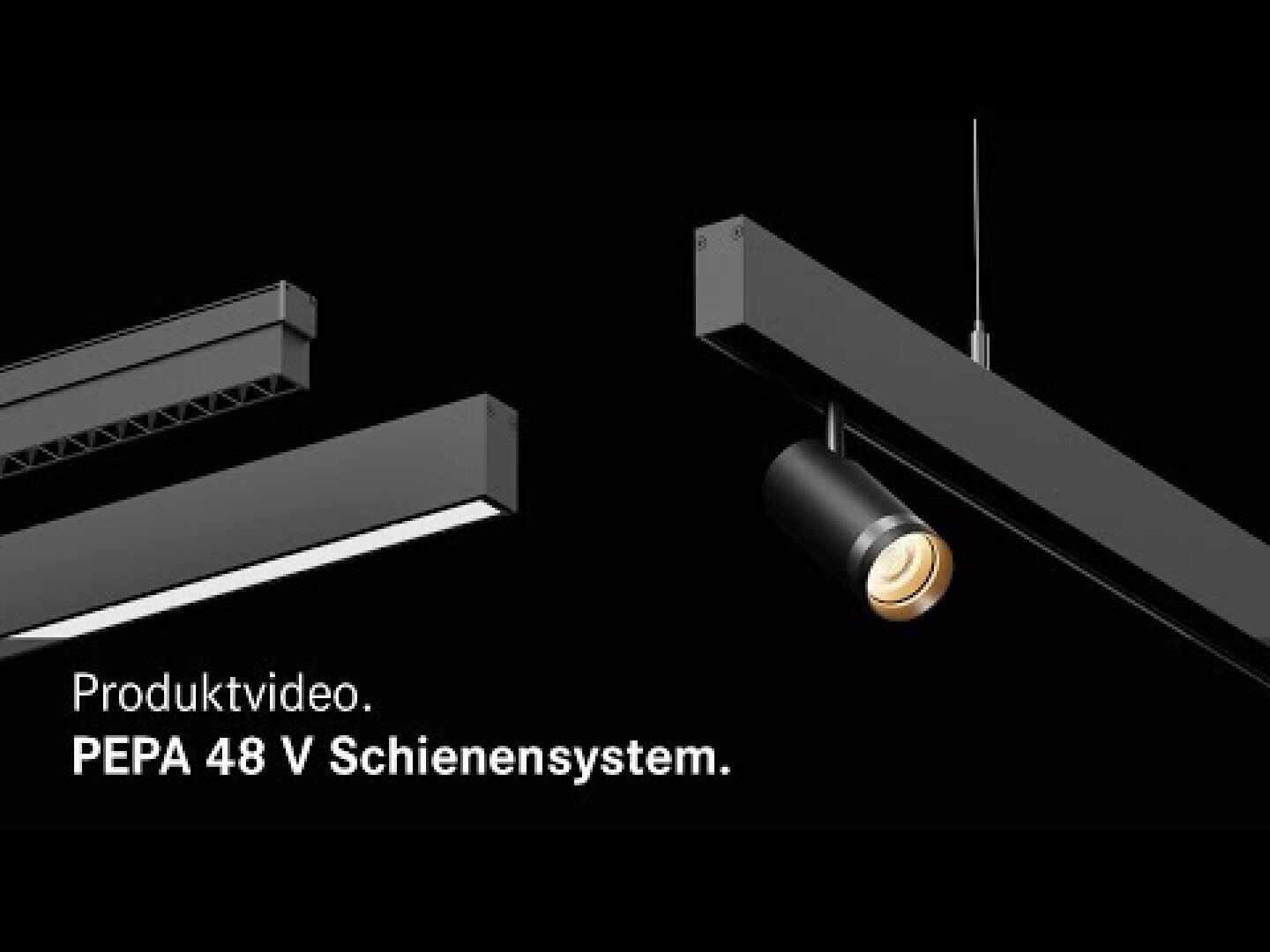 Deux éclairages sur rail noir modernes sont représentés sur un fond noir. Le texte blanc dit : Vidéo produit. Système de rails PEPA 48 V. Un luminaire diffuse une lumière chaude.